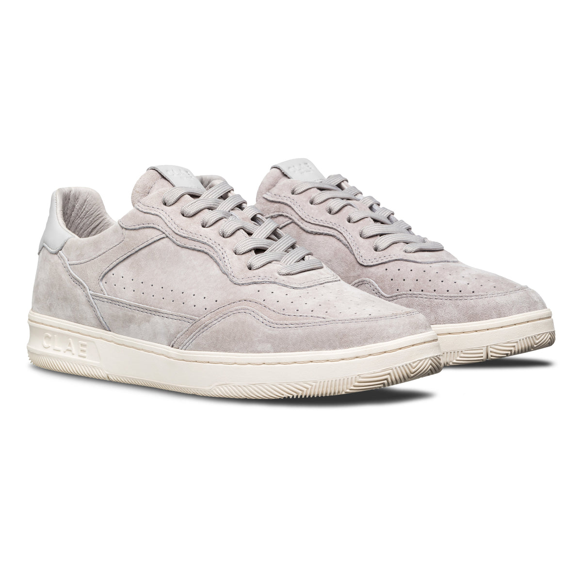 Three-quarter view of Haywood court shoe in Quiet Gray Suede, highlighting all-leather construction and premium finish.