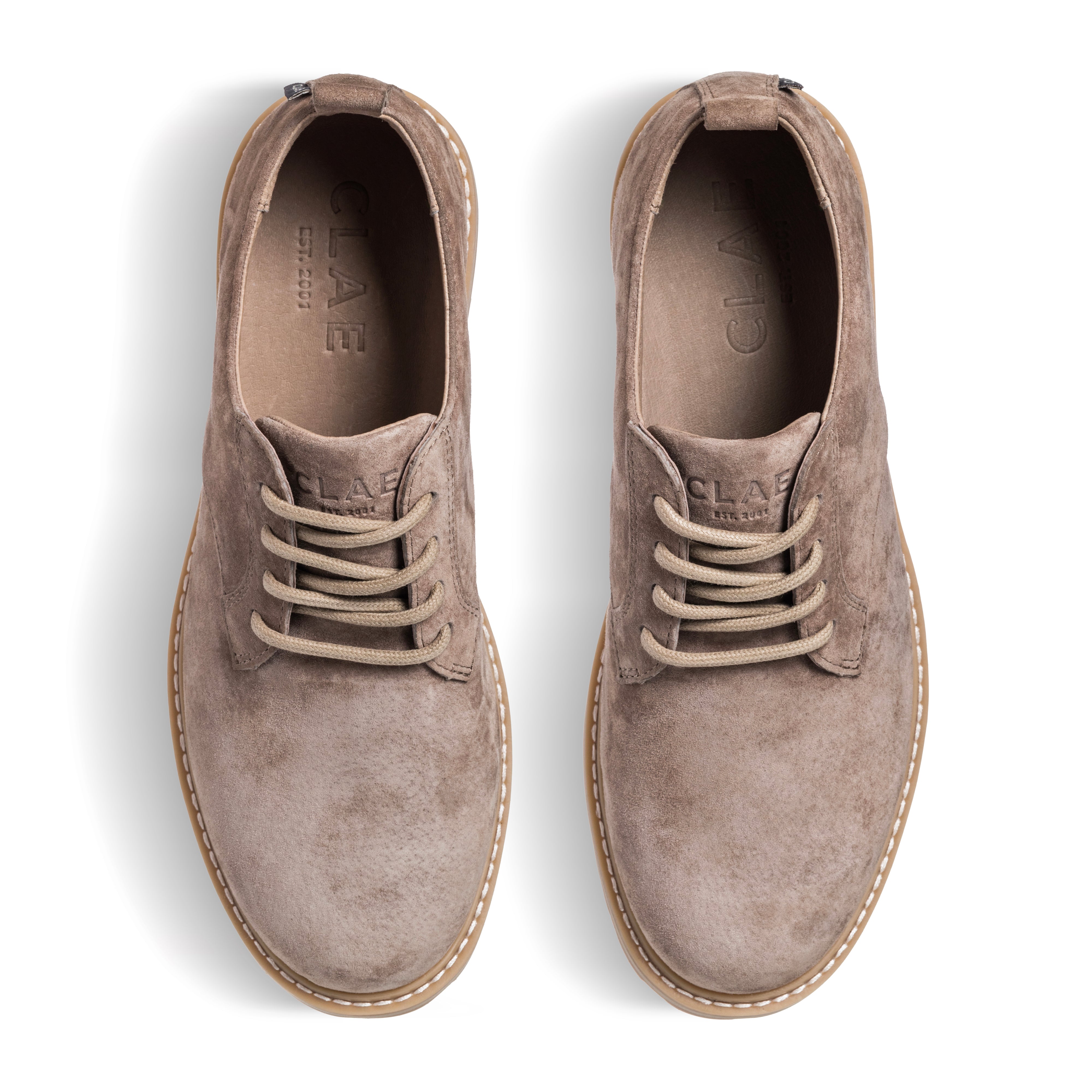 Three-quarter view of Logan Heritage Collection derby shoe in Silver Mink Suede, highlighting premium suede upper and lug sole with welt construction.