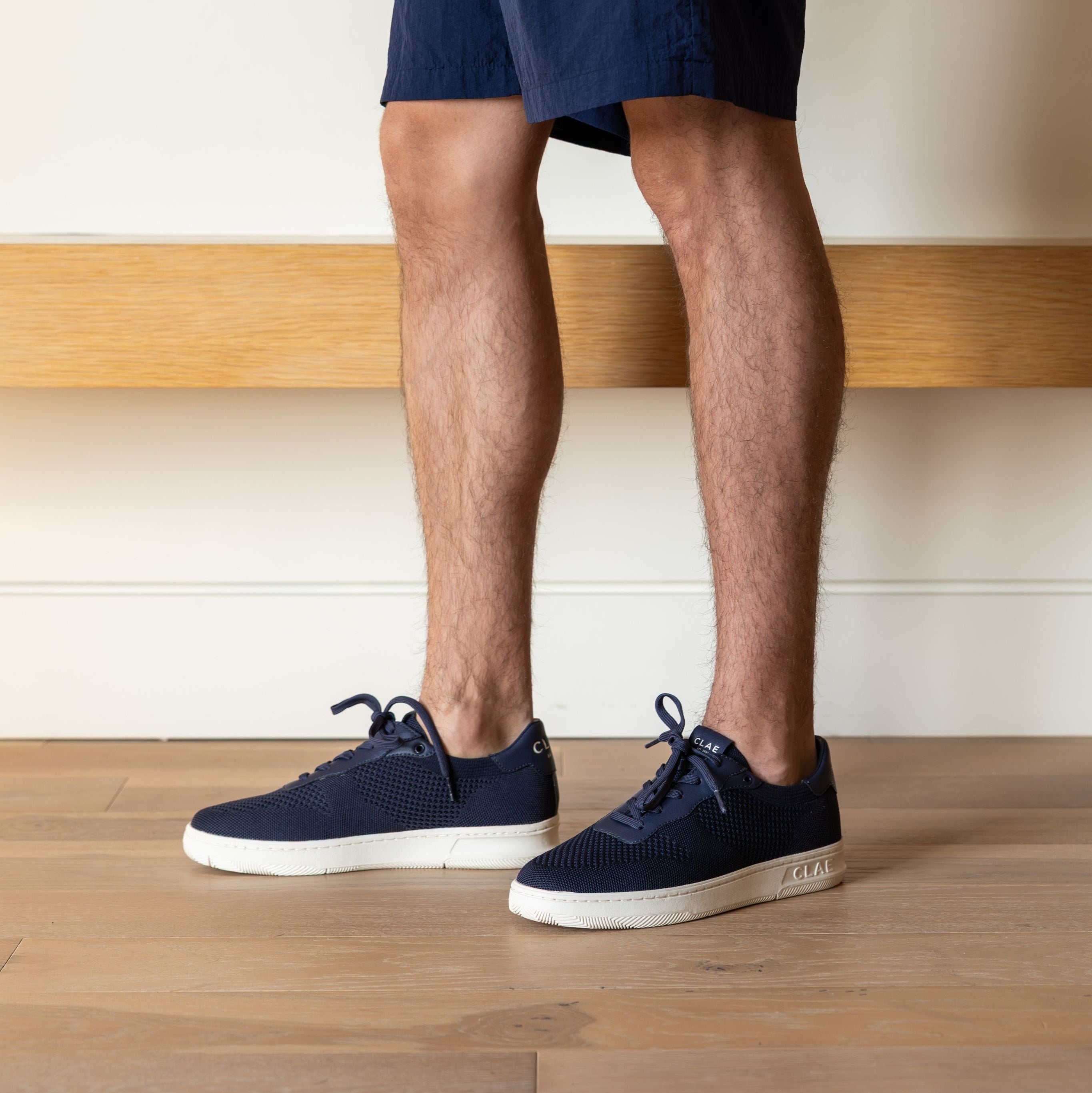 Malone Knit shoe in Navy worn in casual lifestyle setting, highlighting comfort, breathability, and eco-friendly materials.